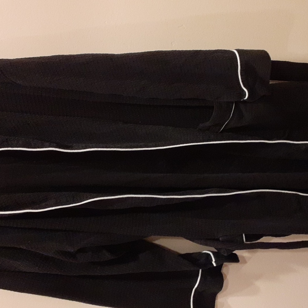 Joseph about bathrobe, black with a white boarded around it